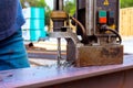 Drilling process with steel beams machinery at construction site during work daytime Royalty Free Stock Photo
