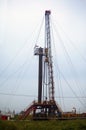 Drilling rig in the clouds Royalty Free Stock Photo