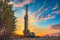 Drilling rig for drilling oil and gas wells on the background of a beautiful sky. Royalty Free Stock Photo