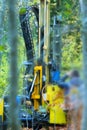 drilling rig drills soil in forest conditions Royalty Free Stock Photo
