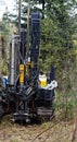 Drilling rig drills soil in forest conditions Royalty Free Stock Photo