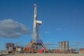 Landscape with a drilling rig in an oil and gas field