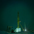 Drilling rig at night.