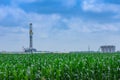 Drilling Rig and oil tanks In South Texas Eagle Ford Shale Royalty Free Stock Photo