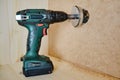 Drilling round holes with a crown on the drill bit. Sawing furniture with a