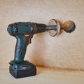 Drilling round holes with a crown on the drill bit. Sawing furniture with a