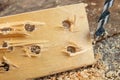 Drilling with a vane drill in chipboard. Carpentry work in a carpentry workshop Royalty Free Stock Photo