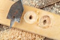 Drilling with a vane drill in chipboard. Carpentry work in a carpentry workshop Royalty Free Stock Photo