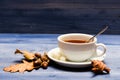 Drink and acorn and oak leaves. Tea served with spoon, sugar and decor as cinnamon. Mug filled with black brewed tea Royalty Free Stock Photo