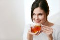Drink. Beautiful Woman Drinking Tea From Cup