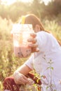 Drink Boba Tea in the grassland, sunset light Royalty Free Stock Photo