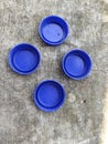 4 drink bottle caps Royalty Free Stock Photo