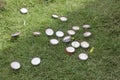 drink bottle caps scattered on the grass Royalty Free Stock Photo