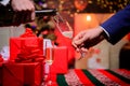 Drink champagne or sparkling wine. Celebrate holiday with champagne. Happy new year. Hands pouring champagne into