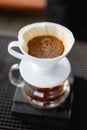 Drink coffee pot is hot, morning cafe,A hand pouring steaming coffee in to a cup on a work desk when work from home