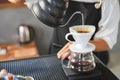 Drink coffee pot is hot, morning cafe,A hand pouring steaming coffee in to a cup on a work desk when work from home