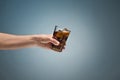 Drink cola in glass with hand Royalty Free Stock Photo