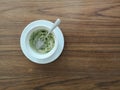 After drink concept close up A white cup of soft drink is MATCHA Green tea late on wooden table Royalty Free Stock Photo