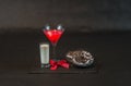 Drink cosmopolitan a glass of martini decorated with a red bow w