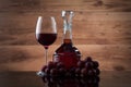 Drink and food. Wineglass, carafe of wine and red grapes Royalty Free Stock Photo