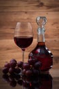 Drink and food. Wineglass, carafe of wine and red grapes Royalty Free Stock Photo