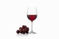 Drink and food. Wineglass, with red wine and red grapes isolate Royalty Free Stock Photo