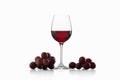 Drink and food. Wineglass, with red wine and red grapes isolate Royalty Free Stock Photo
