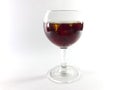 Drink with fruit in a transparent glass. Cherry for a snack. Liquid in a glass. Photo 