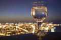 Drink glass and city skyline