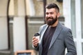 Drink it on the go. Man bearded hipster prefer coffee take away. Businessman drink coffee outdoors. Reloading energy