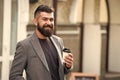 Drink it on the go. Man bearded hipster prefer coffee take away. Businessman drink coffee outdoors. Reloading energy Royalty Free Stock Photo