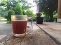 Drink hot black coffee espresso in the garden at home, Lop Buri, Thailand. In the morning, feeling fresh, clear