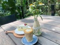 Drink hot coffee cakes, flowers in a vase in nature in the morning forest Royalty Free Stock Photo