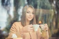 Drink hot coffee with cold water. Young girl woman drinking americano coffee Royalty Free Stock Photo