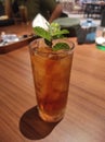 Drink iced tea with mint leaves
