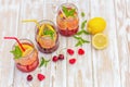 A drink made from lemon, strawberry, raspberry, cherry and mint Royalty Free Stock Photo