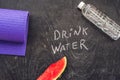 Drink more water - hydration reminder - handwriting on On a chalk board