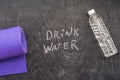 Drink more water - hydration reminder - handwriting on On a chalk board Royalty Free Stock Photo