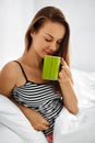 Drink Morning Tea. Woman Drinking Beverage In Bed. Healthy Lifestyle Royalty Free Stock Photo