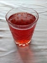 drink with natural berries of strawberry, bright red color, tasty, it is useful, vitamins it is poured in a glass