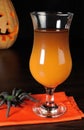 Drink from a pumpkin on Halloween Royalty Free Stock Photo