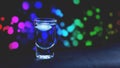 Drink shot in bar on color abstract background Royalty Free Stock Photo