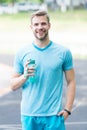 Drink some water. Man with athletic appearance holds water bottle Man athlete sport clothes refreshing. Sport and Royalty Free Stock Photo