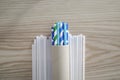 Drink straws, paper tubes Top view of colorful paper disposable eco-friendly straws on white plastic straws Royalty Free Stock Photo