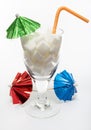 Drink with sugar cubes, umbrellas and straw