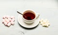 Drink and sweets prepared as dessert. Tea break concept. Mug with black tea and sweets. Mug filled with black brewed tea Royalty Free Stock Photo