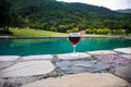 Drink in tall glass in poolside. Refreshment on summer day. Purple juice cocktail or vine. Royalty Free Stock Photo