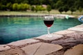 Drink in tall glass in poolside. Refreshment on summer day. Purple juice cocktail or vine. Royalty Free Stock Photo