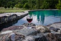 Drink in tall glass in poolside. Refreshment on summer day. Purple juice cocktail or vine. Royalty Free Stock Photo