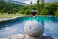 Drink in tall glass in poolside. Refreshment on summer day. Purple juice cocktail or vine. Royalty Free Stock Photo